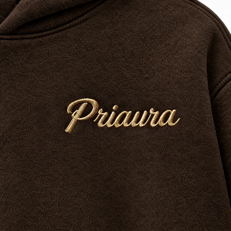 Gold Priaura script on the Espresso hoodie chest