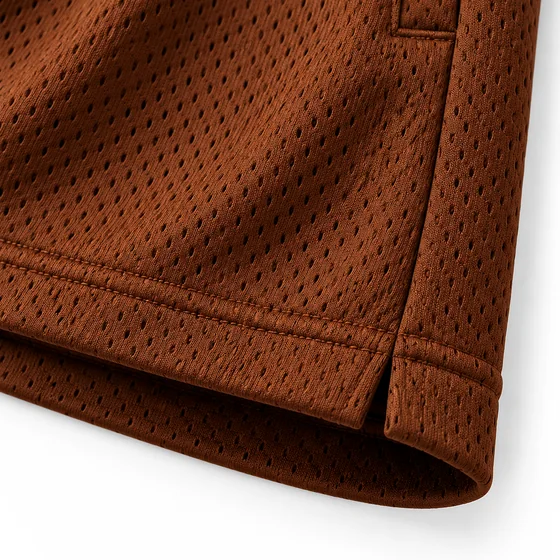 Side split and hem of the Chocolate mesh shorts