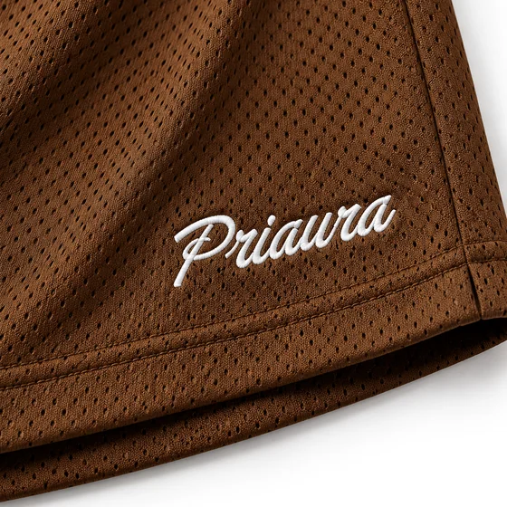 The Priaura script embroidered on Chocolate mesh shorts