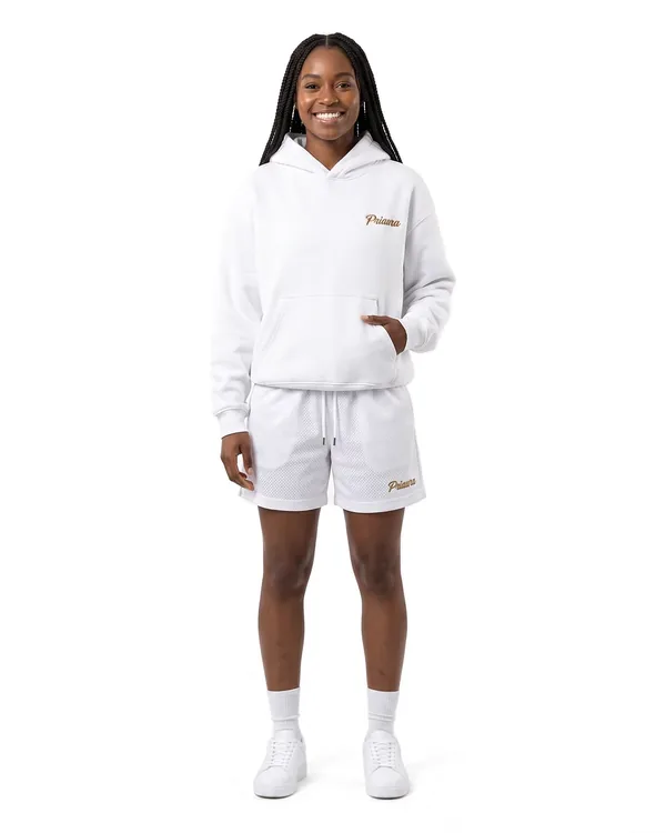 Model in the White hoodie and mesh shorts with the Priaura script in gold thread